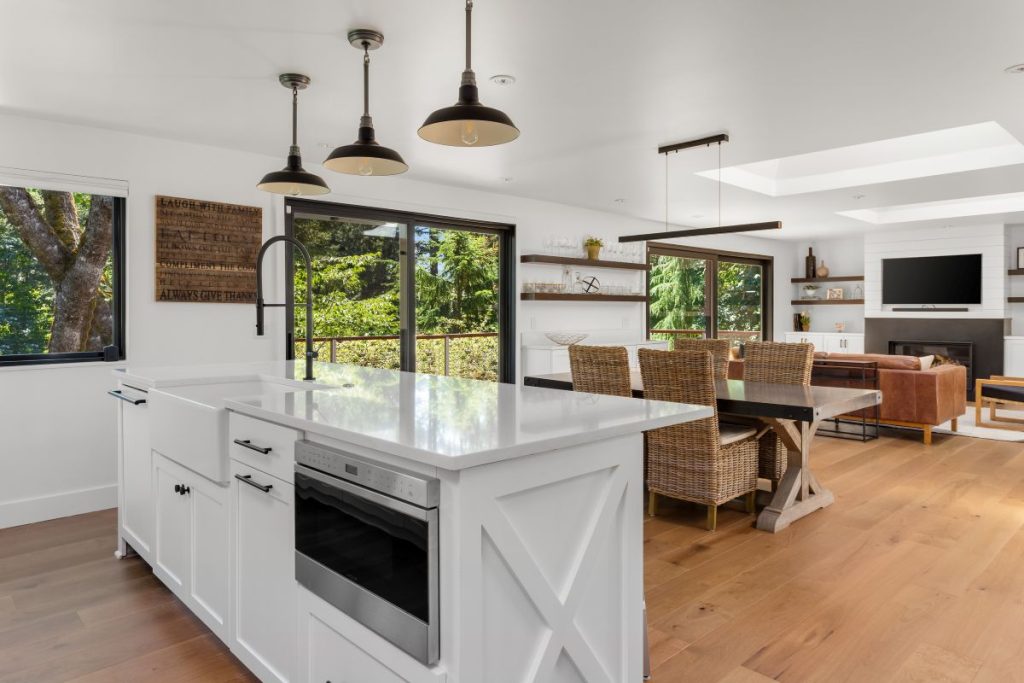 Remodeled home with open-concept layout in kitchen, dining & living room area