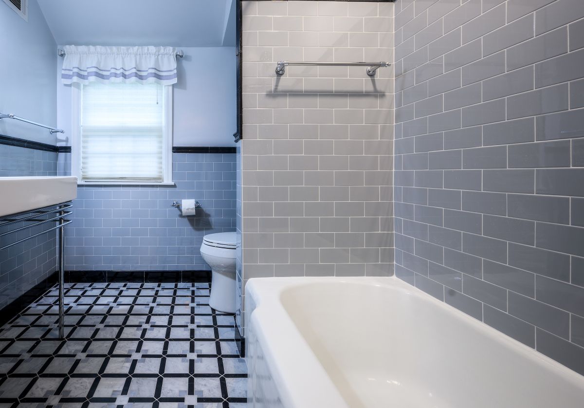 Remodeled bathroom with floor and wall tile